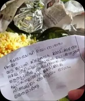 A handwritten note tucked into a packed meal